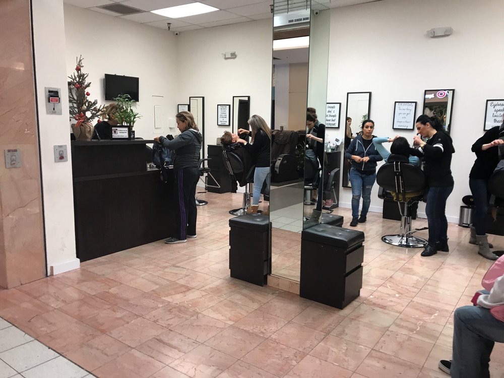 Inside the studio: artists at work at the black chairs and tall mirrors